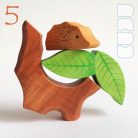 Tree trunk huts with leaf roofs and inhabitants – wooden toy