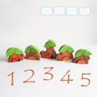 Tree trunk huts with leaf roofs and inhabitants – wooden toy