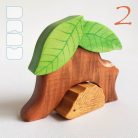 Tree trunk huts with leaf roofs and inhabitants – wooden toy