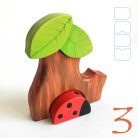 Tree trunk huts with leaf roofs and inhabitants – wooden toy