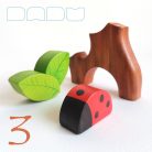 Tree trunk huts with leaf roofs and inhabitants – wooden toy