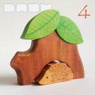 Tree trunk huts with leaf roofs and inhabitants – wooden toy