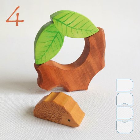 Tree trunk huts with leaf roofs and inhabitants – wooden toy