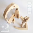 Raw wooden puzzles, nativity scene and stargate