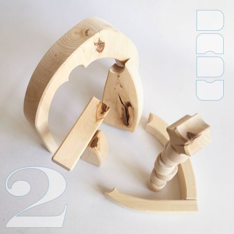 Raw wooden puzzles, nativity scene and stargate