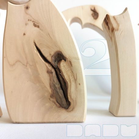 Raw wooden puzzles, nativity scene and stargate