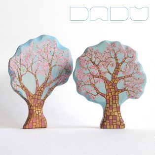   Pink blooming spring trees from the fairy tale forest:  decorative Klimt-inspired wooden toys
