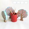   Pink blooming spring trees from the fairy tale forest:  decorative Klimt-inspired wooden toys